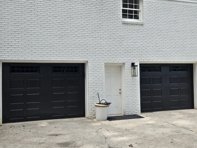 The same house with both garage doors now black